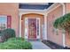 Charming brick home featuring a welcoming front door with decorative wreath and covered entry at 3258 Kessock Ridge Trl, Snellville, GA 30039