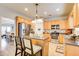 Well-lit kitchen featuring stainless steel appliances, granite countertops, and a charming island with bar seating at 3258 Kessock Ridge Trl, Snellville, GA 30039