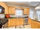 Bright kitchen boasts modern appliances, ample cabinet space, and a convenient stainless steel dishwasher at 3258 Kessock Ridge Trl, Snellville, GA 30039