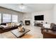 Bright and airy living room with fireplace, hardwood floors, and plush seating for a comfortable setting at 3258 Kessock Ridge Trl, Snellville, GA 30039