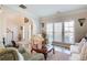 Cozy living room filled with natural light, hardwood floors, and comfortable seating for relaxation at 3258 Kessock Ridge Trl, Snellville, GA 30039