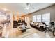 Expansive living room with a view of the kitchen, hardwood floors, and plenty of seating for Gathering and guests at 3258 Kessock Ridge Trl, Snellville, GA 30039