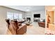 Spacious living room with hardwood floors, fireplace, and ample natural light offering a cozy gathering space at 3258 Kessock Ridge Trl, Snellville, GA 30039