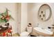 Well-appointed powder room featuring a pedestal sink, decorative mirror, and stylish decor at 3258 Kessock Ridge Trl, Snellville, GA 30039