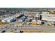 Expansive aerial view showcases modern townhomes close to vibrant commercial areas at 6750 Avis Walk, Alpharetta, GA 30005