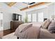 Bright bedroom with shiplap walls, dark wood floors, and a large bed at 6750 Avis Walk, Alpharetta, GA 30005