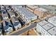 Aerial view of three-story townhomes, modern farmhouse style homes, businesses, and retail buildings at 6750 Avis Walk, Alpharetta, GA 30005
