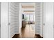 Bright hallway with shiplap walls, dark wood floors, and a view into the living room at 6750 Avis Walk, Alpharetta, GA 30005