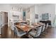 Bright kitchen and dining area with dark wood floors and a large center island with bar stool seating at 6750 Avis Walk, Alpharetta, GA 30005