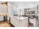 Bright, open kitchen featuring a large island, stainless steel appliances, and hardwood floors at 6750 Avis Walk, Alpharetta, GA 30005