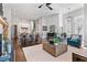 Open-concept living space with a fireplace, kitchen, dining area, and stylish furniture at 6750 Avis Walk, Alpharetta, GA 30005