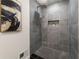 Modern shower with gray tile and a rain shower head at 2645 Gwendon Ct, Decatur, GA 30034