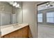 Bright bathroom with updated vanity and a view of the bedroom at 425 Chapel Sw St # 1407, Atlanta, GA 30313