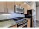 Modern kitchen with granite countertops and stainless steel appliances at 425 Chapel Sw St # 1407, Atlanta, GA 30313