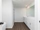 A bathroom with a tub and shower area, and a large sink vanity at 726 Ocmulgee Xing, Locust Grove, GA 30248