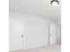 Bright bedroom features neutral carpet, walls, and a white closet door at 726 Ocmulgee Xing, Locust Grove, GA 30248