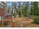 Large backyard with wooden retaining wall at 3293 Hobart Nw Dr, Atlanta, GA 30318