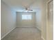 Well-lit bedroom featuring a ceiling fan and window at 3293 Hobart Nw Dr, Atlanta, GA 30318