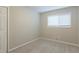Simple bedroom with neutral walls and carpet at 3293 Hobart Nw Dr, Atlanta, GA 30318