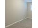 Simple bedroom with gray carpet and window at 3293 Hobart Nw Dr, Atlanta, GA 30318