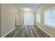 Dining area with wood-look floors and brick accent wall at 3293 Hobart Nw Dr, Atlanta, GA 30318
