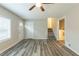 Spacious living area with wood-look floors, and stairs to the upper level at 3293 Hobart Nw Dr, Atlanta, GA 30318