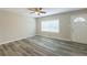 Bright living room featuring wood-look floors and a large window at 3293 Hobart Nw Dr, Atlanta, GA 30318