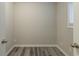 Small office space with wood-look flooring and window at 3293 Hobart Nw Dr, Atlanta, GA 30318