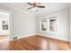 Spacious empty bedroom features hardwood floors, base-molding, and natural light at 1015 Deckner Sw Ave, Atlanta, GA 30310