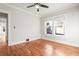 Empty bedroom features hardwood floors, a ceiling fan, and natural light from windows at 1015 Deckner Sw Ave, Atlanta, GA 30310