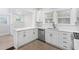 Modern kitchen features white cabinets, quartz countertops, stainless steel appliances, and an eat-in breakfast bar at 1015 Deckner Sw Ave, Atlanta, GA 30310