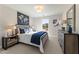 Bedroom with neutral colors, cozy bedding, and a large window at 4511 Twinberry Dr, Powder Springs, GA 30127