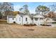 Stylish exterior view of a modern craftsman home, featuring clean lines, a spacious yard, and inviting porch at 1009 Manor Se Dr, Smyrna, GA 30080