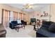 Spacious living room offering plush seating, neutral carpeting, and a fireplace for cozy gatherings at 6469 Alder Ln, Norcross, GA 30093
