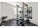 Finished workout room features weight lifting equipment and a large mirror at 3330 Harmony Hill Rd, Kennesaw, GA 30144