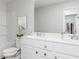 Clean bathroom featuring a shower-tub combo and a large double vanity providing ample counter space at 313 Chattahoochee Cir, Locust Grove, GA 30248