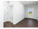 Welcoming foyer offers dark wood-look flooring, white trim, and a glass-paneled entry door at 313 Chattahoochee Cir, Locust Grove, GA 30248