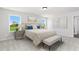 Serene main bedroom with a comfortable bed, ample natural light, and elegant furnishings at 313 Chattahoochee Cir, Locust Grove, GA 30248