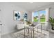 Well-lit office space featuring a modern desk, stylish decor, a large window, and scenic outdoor views at 313 Chattahoochee Cir, Locust Grove, GA 30248