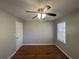 Bedroom with hardwood flooring, ceiling fan, and a window providing natural light at 854 Fayetteville Se Rd, Atlanta, GA 30316