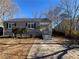 Gray house with a gray roof, steps, and small bushes in front at 854 Fayetteville Se Rd, Atlanta, GA 30316