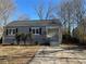 Gray house with a gray roof, steps, and small bushes in front at 854 Fayetteville Se Rd, Atlanta, GA 30316