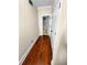 Hardwood floor hallway with access to bathroom at 1054 Sw Morgan Garner Dr, Lilburn, GA 30047