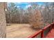 Spacious backyard view from the deck featuring mature trees at 3413 Talking Creek Ct, Conyers, GA 30094