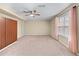 Spacious basement bedroom featuring natural light, carpeting, and closet space for storage at 3413 Talking Creek Ct, Conyers, GA 30094