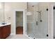 En-suite bathroom with frameless glass shower and walk in closet entrance at 3413 Talking Creek Ct, Conyers, GA 30094
