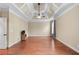 Spacious bedroom with tray ceilings, a ceiling fan, and hardwood floors at 3413 Talking Creek Ct, Conyers, GA 30094