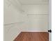 Walk in closet features wire shelving and hardwood floors at 3413 Talking Creek Ct, Conyers, GA 30094