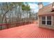 View of the spacious wood deck with railing and the side of the home at 3413 Talking Creek Ct, Conyers, GA 30094
