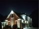 Charming brick home at night with attractive exterior lighting highlighting architectural details at 3413 Talking Creek Ct, Conyers, GA 30094